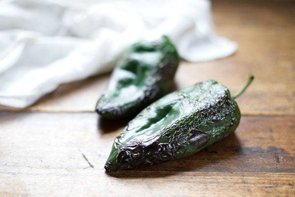 Peppers on a wooden surface.