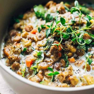 One-Pot Creamy Spinach Lentils in a bowl with spoon.
