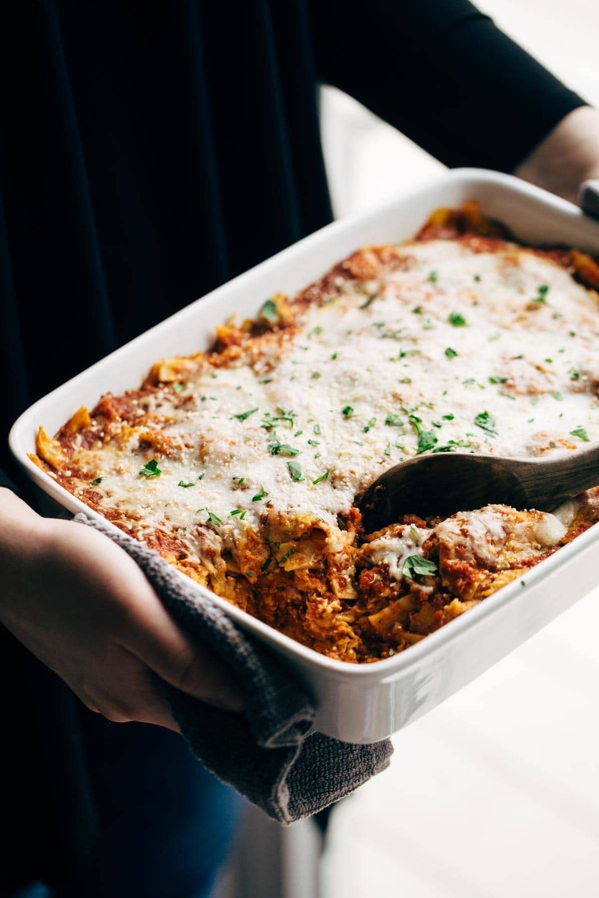 Sofritas casserole in a dish with a wooden spoon.