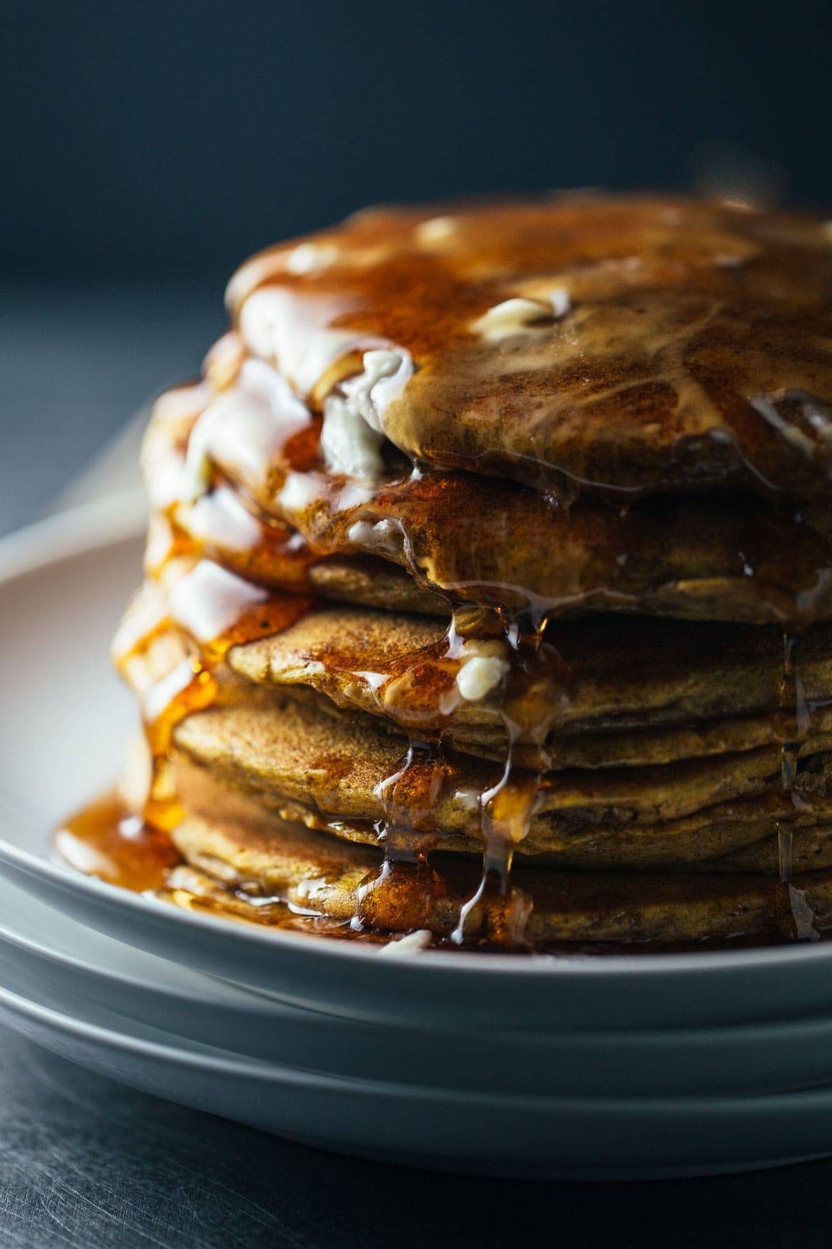Cinnamon Pumpkin Pancakes with syrup.